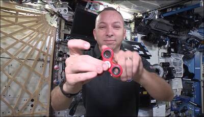 Feeling fidgety? ISS astronauts have fun with a fidget spinner in space - Watch