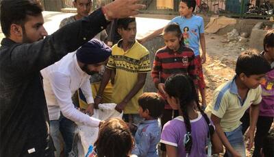 BJP's Tajinder Bagga distributes firecrackers among slum kids in Delhi's Hari Nagar