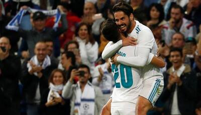 Real, Atletico win to keep the pressure on La Liga leaders Barcelona