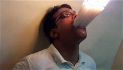Mumbai man stuffs his mouth with 22 lit candles at once, sets world record - Watch