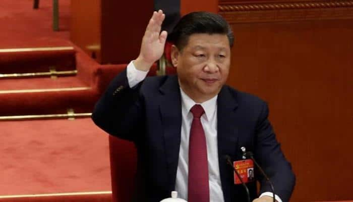 Xi joins Mao in Communist constitution, tightening grip on China