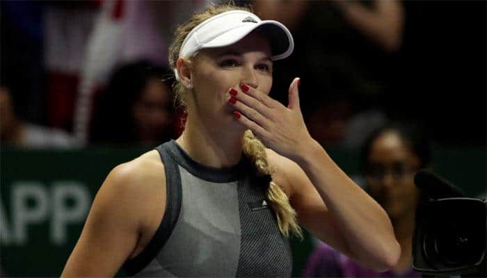 WTA Finals: Caroline Wozniacki swats aside Simona Halep in Singapore