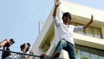 Birthday boy Shah Rukh Khan waves to the ocean of fans outside Mannat