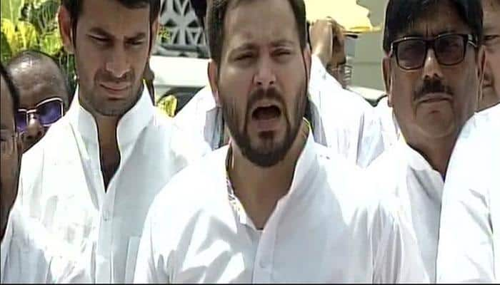 JD(U) releases old photo of Tejashwi with woman, RJD scion hits back