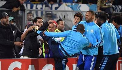 Karate-kick Patrice Evra suspended by Marseille, charged by UEFA
