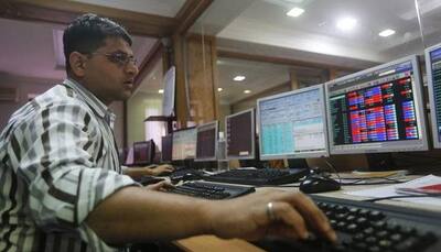 Sensex ends at new peak; Nifty slips from record high