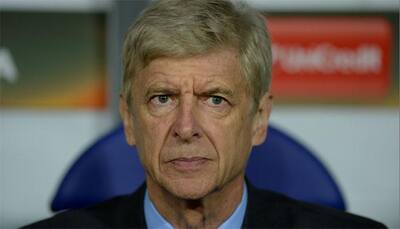 Arsene Wenger says wants to see out contract at Arsenal