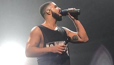 Drake pauses show to threaten male fan groping women