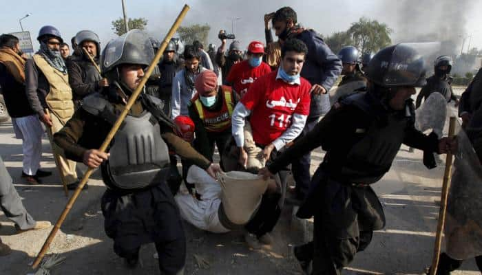 Pakistan burns: 1 killed, 130 injured during crackdown on Islamist protest, media blackout issued