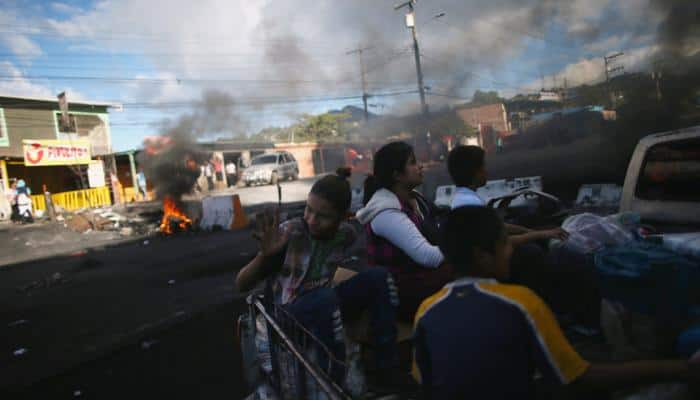 Honduras awaits presidential vote count as army enforces curfew