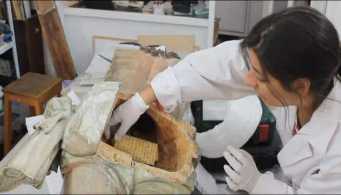 Restorers uncover 250-year-old &#039;time capsule&#039; inside Jesus Christ&#039;s statue – Watch