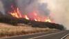 As winds relent, scorched California hopes for fire relief