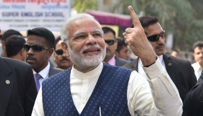 &#039;Roadshow&#039;, chants &amp; cheers as PM Modi votes, Congress calls EC a puppet