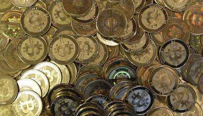 Bitcoin slips below $14,000, down 30% from record peak