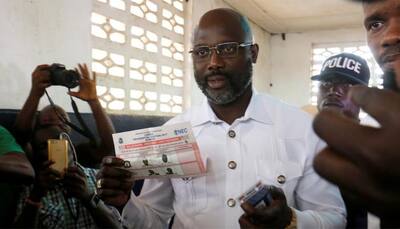 Ex-footballer, vice-president contend in Liberia leadership vote