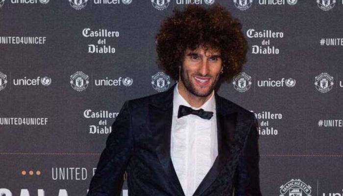 Belgium and Manchester United midfielder Marouane Fellaini complains of mistreatment in England