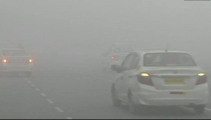 Dense fog greets New Year across northern India, Delhi airport shut, trains hit