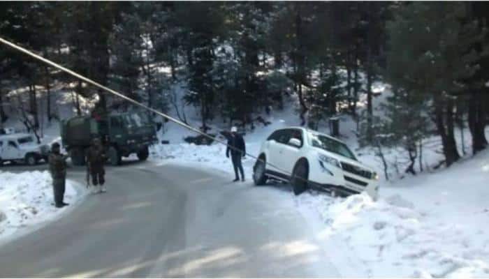 Indian Army rescues tourists after private car slips off snow-covered J&amp;K road