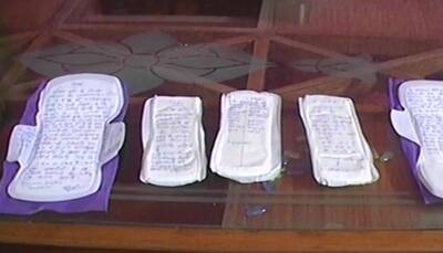 Activists write on sanitary pads to protest 12% GST, demand waiver