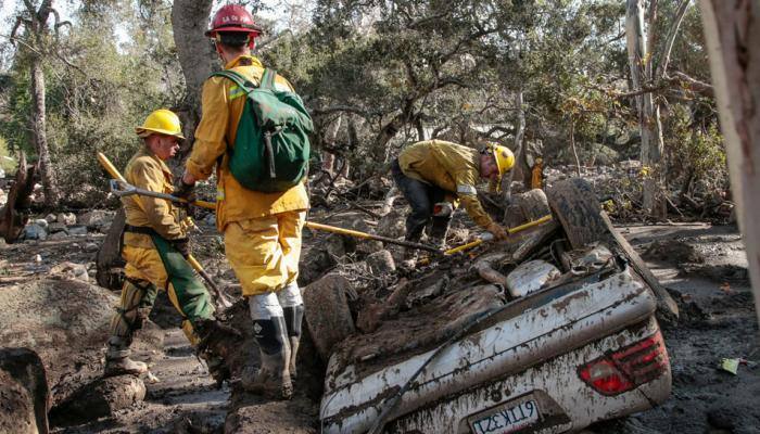 Twenty dead in California mudslides, major highway closed