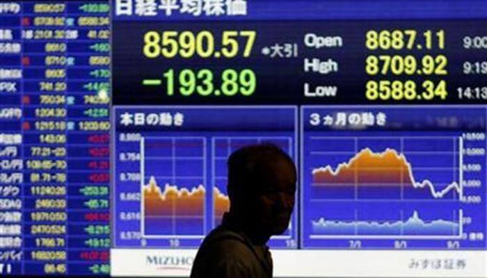 Nikkei closes at 26-year high on yen&#039;s softer tone