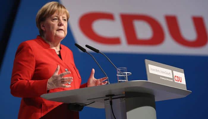 Angela Merkel upbeat as coalition talks with Germany&#039;s Social Democrat start
