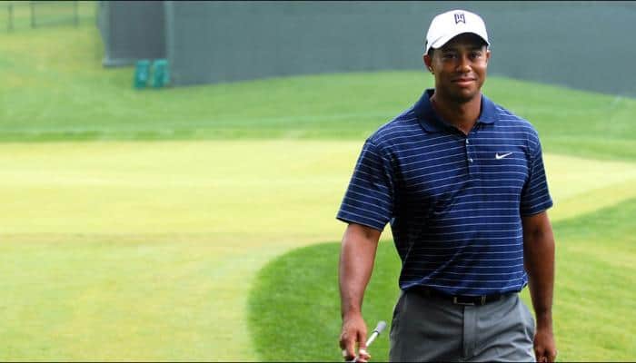Tiger Woods birdies his final hole to make cut in PGA Tour return