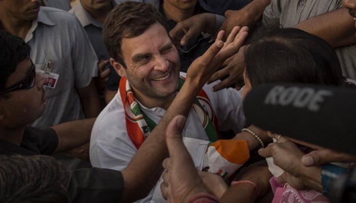 In pics: Rahul Gandhi helps co-passengers place luggage onboard flight