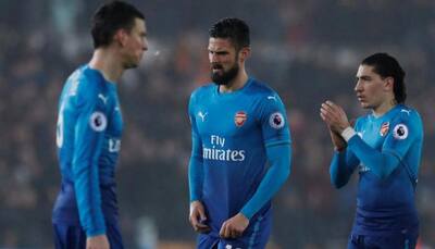 English Premier League: Arsenal shocked by Swansea City, Liverpool cruise to win