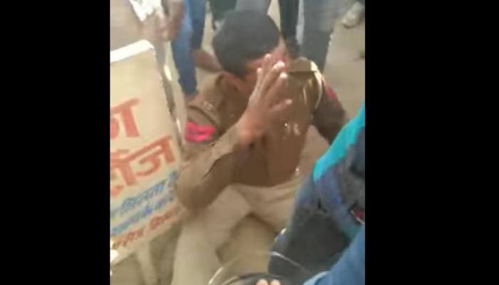 Drunk cop on duty tries to molest girl, gets thrashed by locals