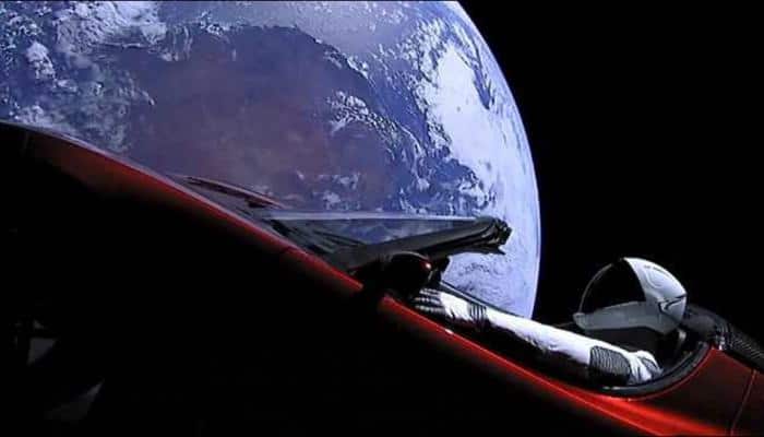Elon Musk&#039;s cherry red Tesla Roadster spotted &#039;zooming&#039; in space