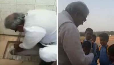 BJP MLA cleans toilet seat with bare hands, cuts students' nails as part of Swachh Bharat mission - Watch