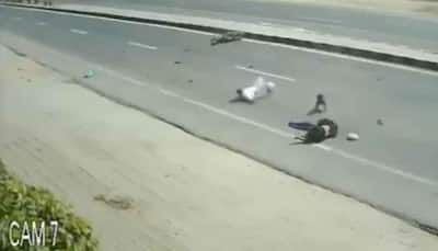 Caught on camera: Jeep rams into a motorcycle, family of three has a narrow escape