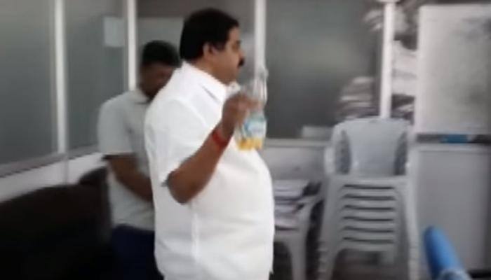 Caught on camera: Karnataka Congress leader sprinkles petrol, threatens to set govt office on fire