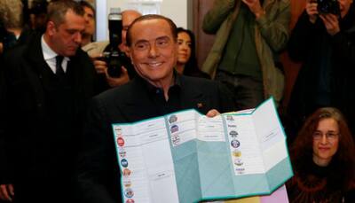 Silvio Berlusconi's right-wing coalition ahead in Italy vote: Exit polls