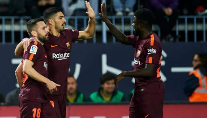 La Liga: Barcelona stroll past Malaga without Lionel Messi