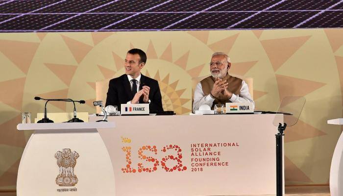 Emmanuel Macron takes a dig at Donald Trump for leaving Paris Accord; hails India&#039;s efforts