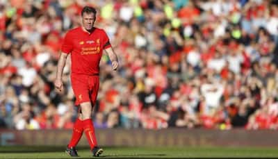 Former Liverpool defender Jamie Carragher apologises for spitting at a girl