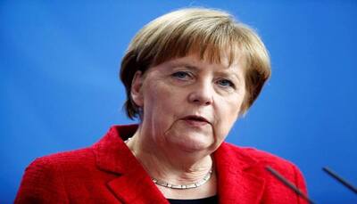 Angela Merkel says she will visit French President Macron to discuss EU reform