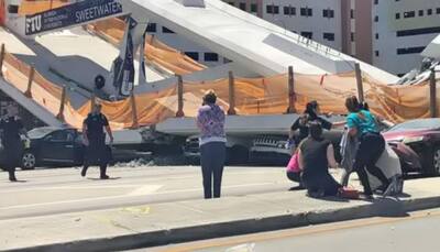 Pedestrian bridge collapses on cars in Miami, several feared trapped