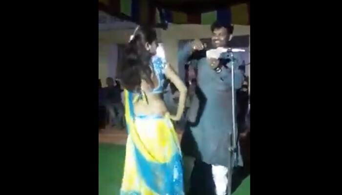 Watch: RJD leader dances, misbehaves with female performer, throws away cash