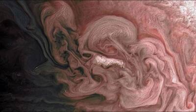 Flying across Jupiter's clouds, NASA's Juno gets close to a 'rosy' storm – See pic