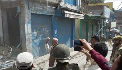 Jammu and Kashmir: BJP leader caught stone pelting on police in Rajouri