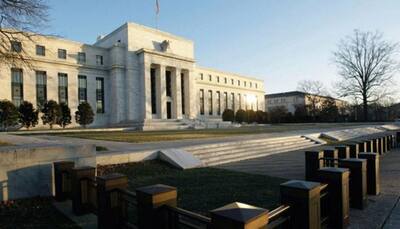 Federal Reserve raises rates, signals confidence in strengthening economy