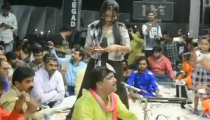 Watch: Audience showers wads of notes as singer Kirtidan Gadhvi performs on stage