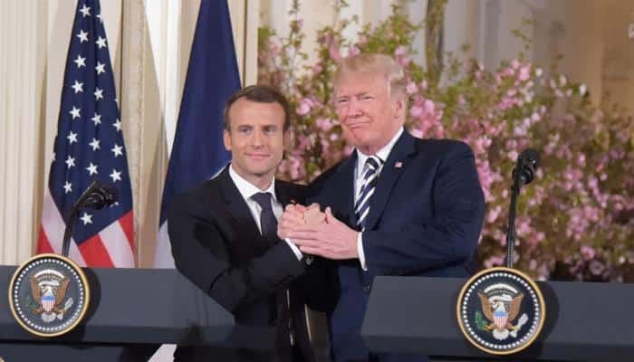 To make French President &#039;perfect&#039;, Donald Trump brushes dandruff off Emmanuel Macron&#039;s jacket