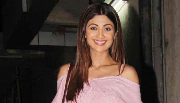 Shilpa Shetty looks stylish in this pink top, flared denim  — See photos