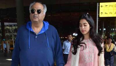 Janhvi Kapoor walks hand-in-hand with father Boney as they arrive back in Mumbai 
