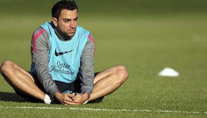 Spanish great Xavi to play on until at least end of year