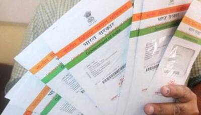 Govt mulling making Aadhaar or passport must for flying